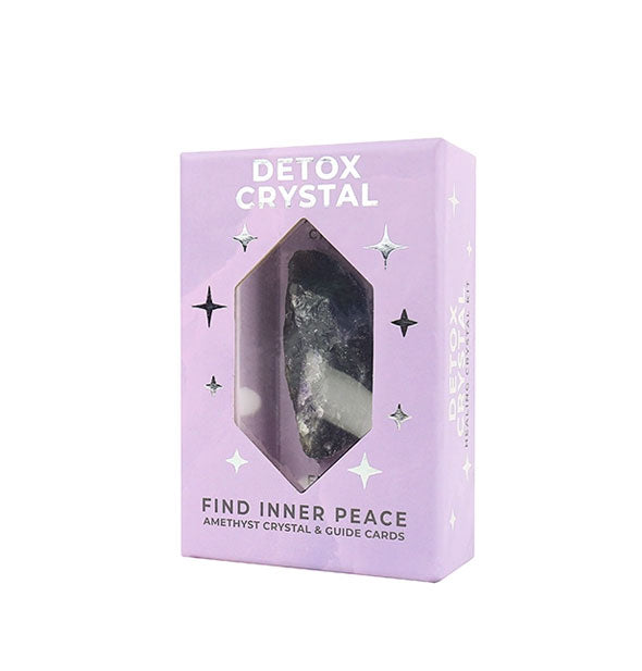 Purple Detox Crystal kit box with metallic silver design elements and window through which a purple amethyst crystal inside is visible