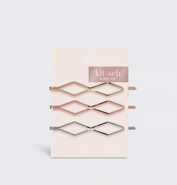 Pack of three diamond-shaped gold, rose gold, and silver bobby pins by Kitsch