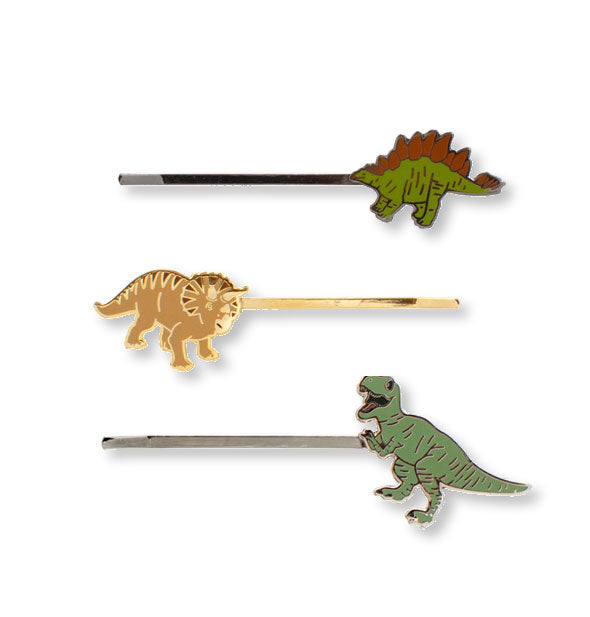 Enamel and gold Stegosaurus, Triceratops, and Tyrannosaurus rex hair pins