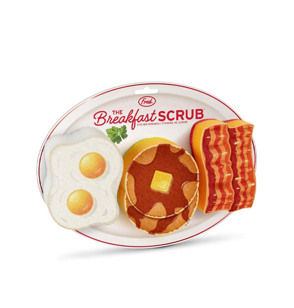 The Breakfast Scrub dish sponges resembling eggs, pancakes, and bacon affixed to a Fred "diner plate" product card