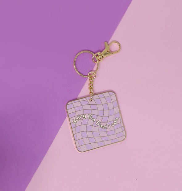 Square enamel keychain with rounded corners, gold hardware, and a pink and purple checkered pattern says, "Doing the best I can" in white lettering
