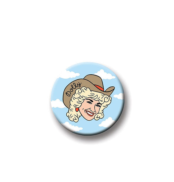 Round Dolly Parton magnet by The Found with charicature of Dolly in cowboy hat on a backdrop of clouds and blue sky.