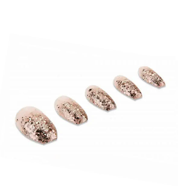 Mid-length square-tipped press-on nails with gold glitter tips and soft pink bases