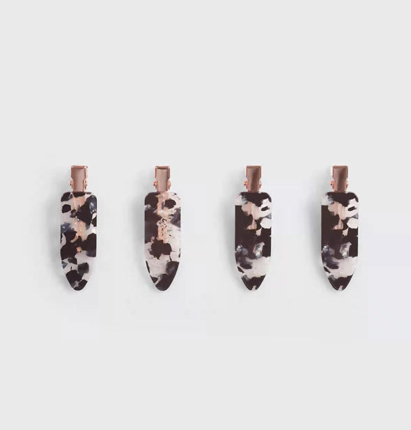 Four terrazzo-effect hair clips with rose gold hardware