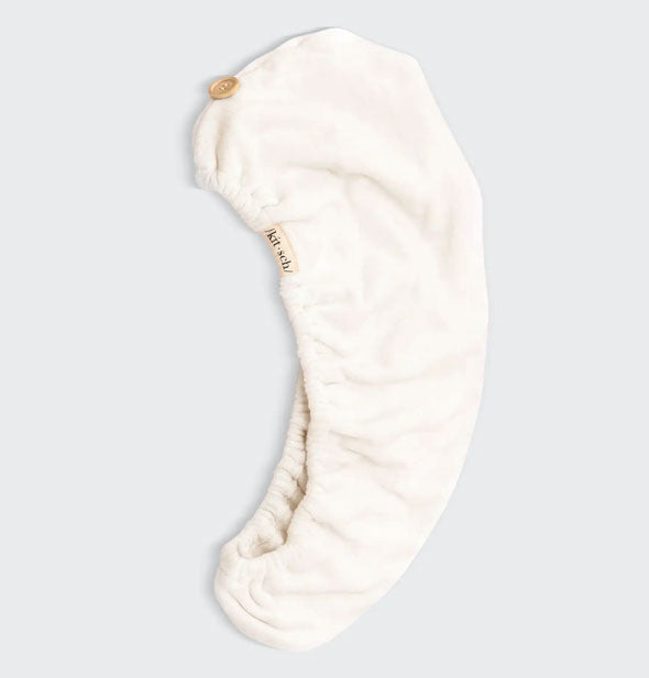 Eco-Friendly White microfiber hair towel wrap by Kitsch lays flat to show button closure and elastic opening