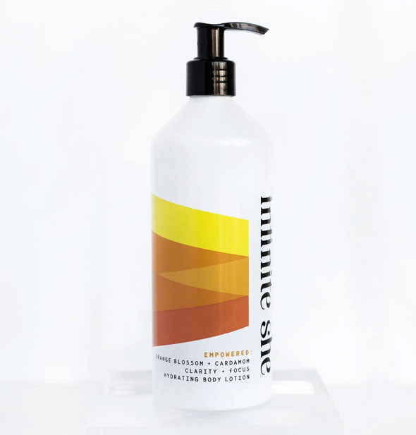 14 ounce pump bottle of Infinite She Empowered Orange Blossom + Cardamom Hydrating Body Lotion