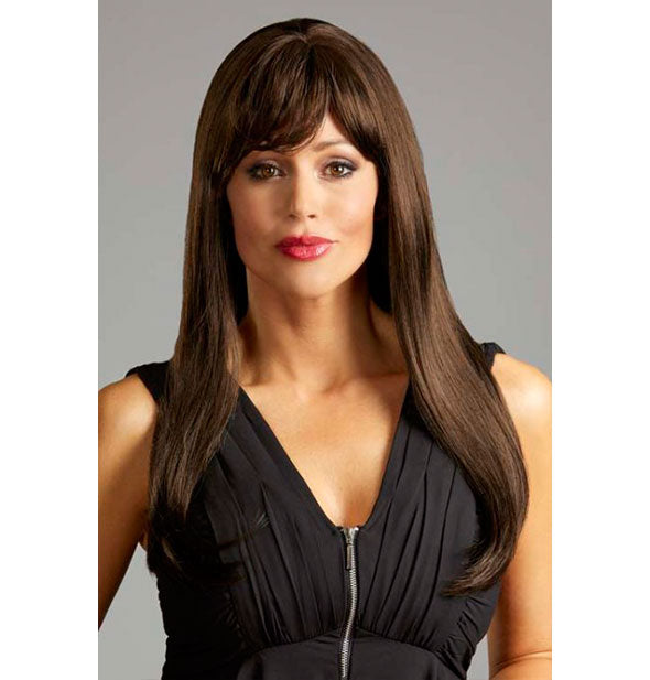Model wearing a long, dark brown wig with bangs.