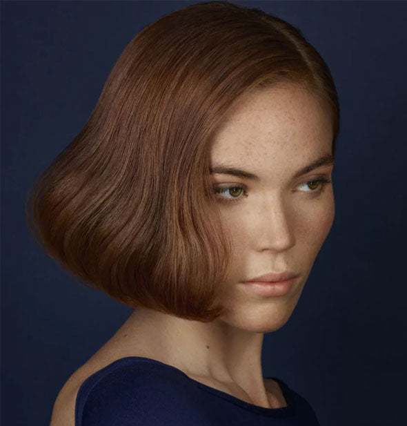 Model with short, side-parted, curled-under bob style