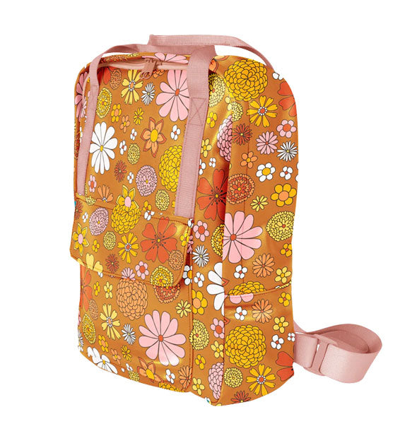 Rectangular orange backpack with all-over retro-style colorful floral illustrations and pale pink straps
