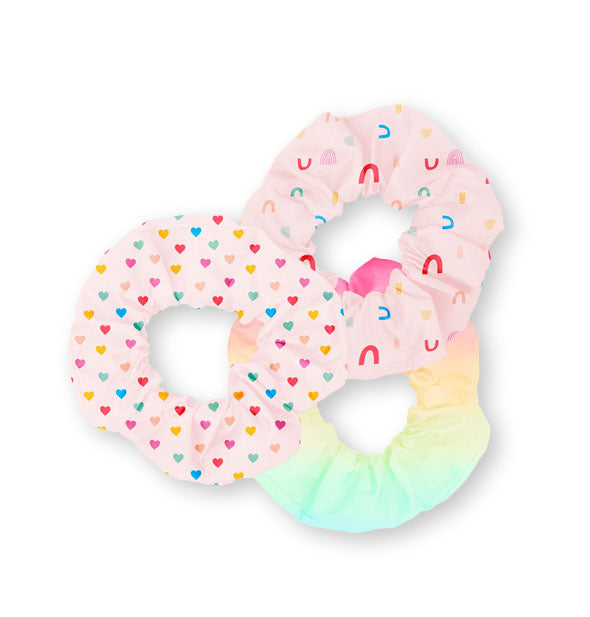 Three hair scrunchies in rainbow prints