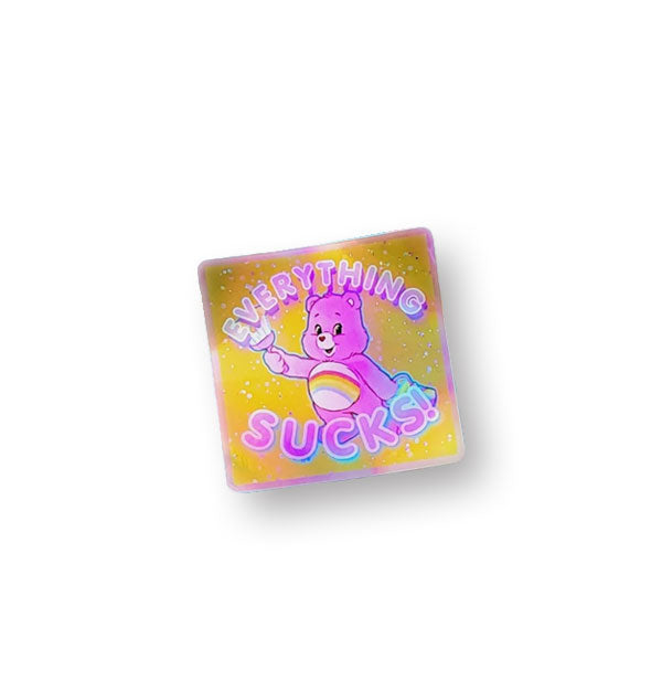 Square sticker with gold background features predominantly pick Cheer Bear and says, "Everything Sucks!" in pink lettering