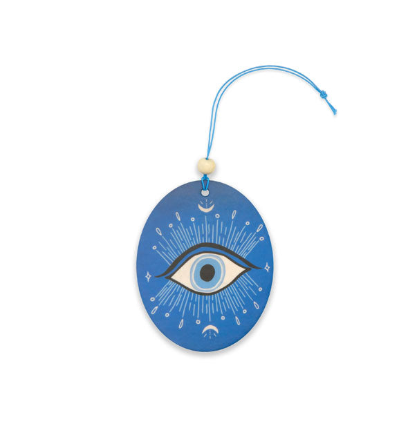 Blue oval car air freshener on blue string with bead features an evil eye design with celestial accents