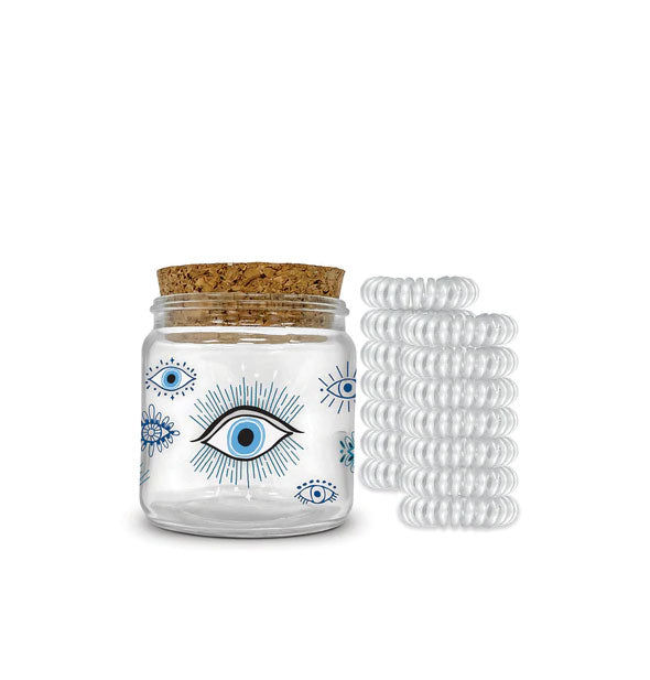 Cork-lidded jar with evil eye illustrations is paired with 12 clear spiral hair ties