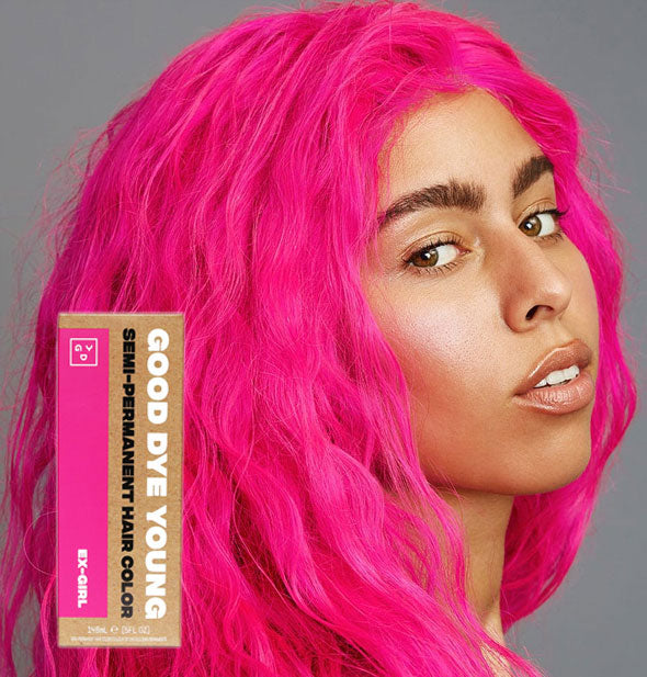 Model with bright pink hair color by Good Dye Young in the shade Ex-Girl
