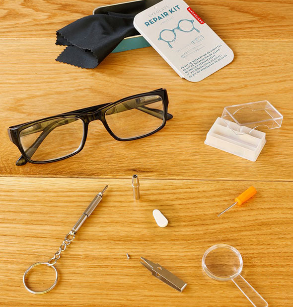 Contents of the Eyeglass Repair Kit spread out on a wooden surface