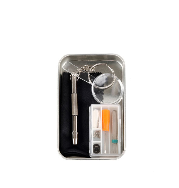 Tin and contents of the Eyeglass Repair Kit