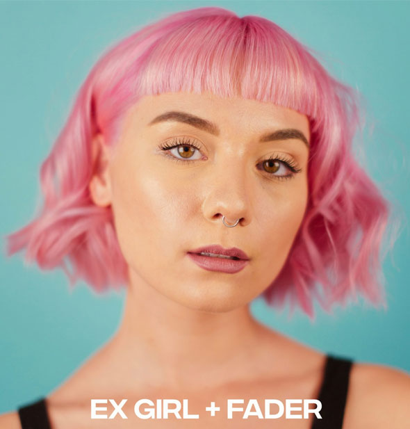 Model with pastel pink hair color represents mixing Good Dye Young Ex-Girl hair dye with Fader additive