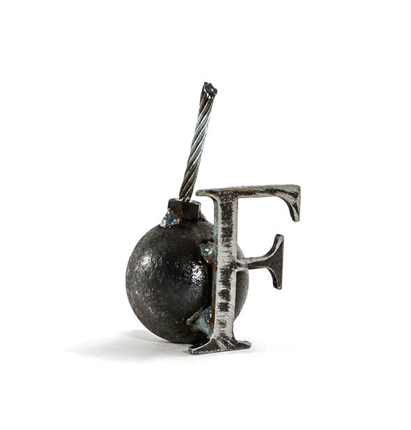 A steel bomb sculpture with F attached