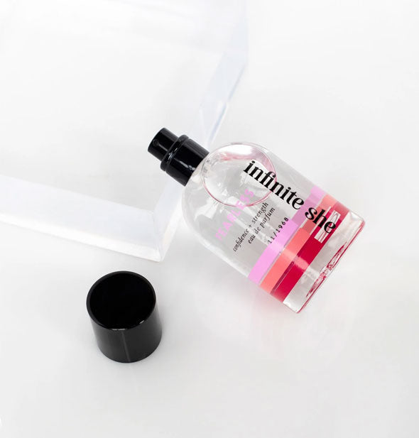 50 ml bottle of Infinite She Fearless eau de parfum with cap removed