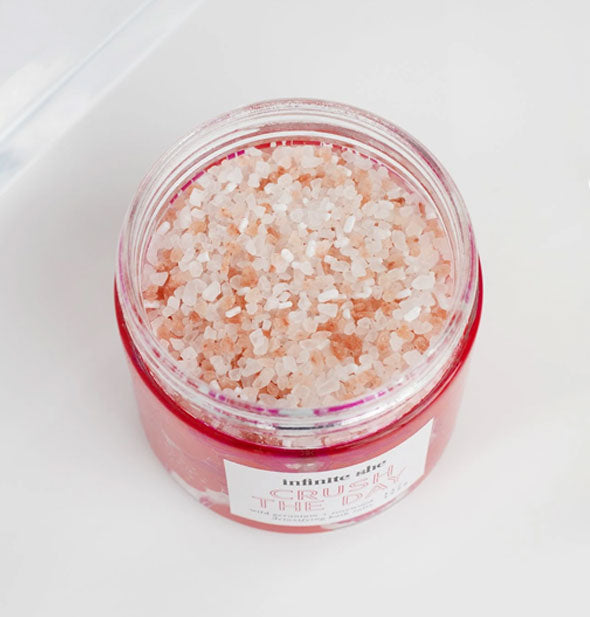 Open pot of bath salts with crystals shown inside