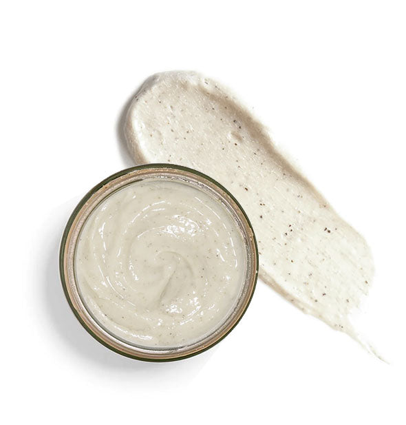 Top view of a jar of Finely Awake exfoliating cleanser with product sample application beside it
