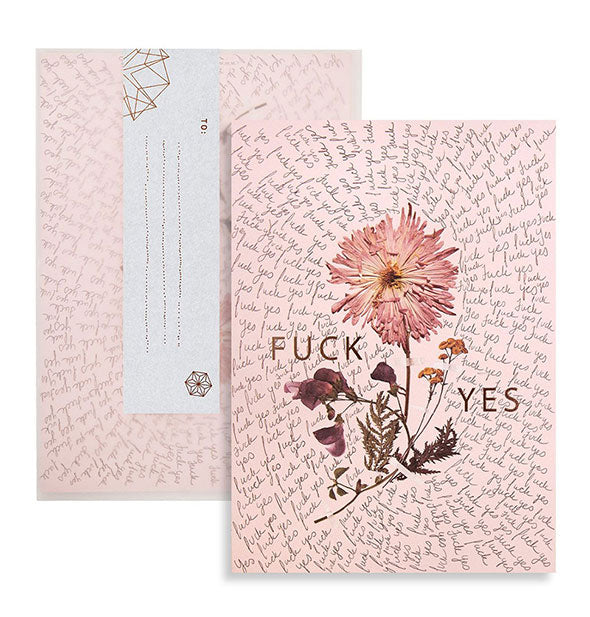 Pink greeting card with intricate floral and all-over script design says, "Fuck yes" in metallic lettering
