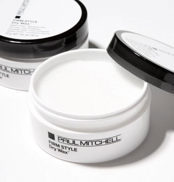 A pot of Paul Mitchell Firm Style Dry Wax with lid removed to show product inside