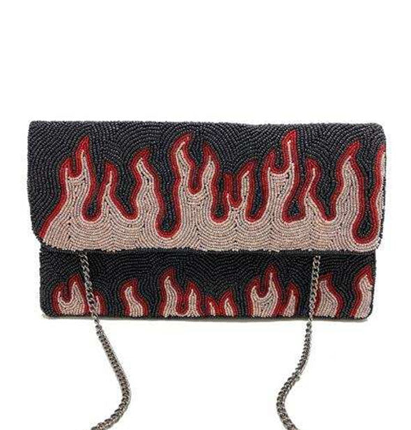 Clutch with silver chain features all-over beading in black, red, and beige with a flame design