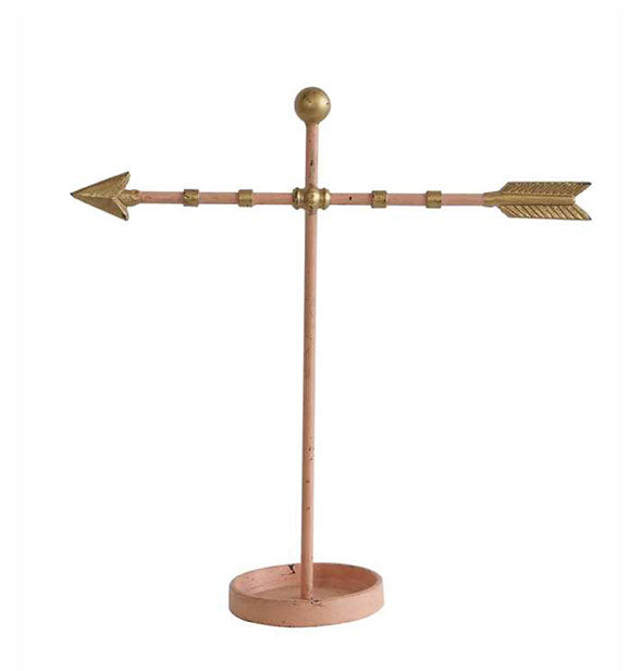 Arrow-shaped brass jewelry holder on round dish base