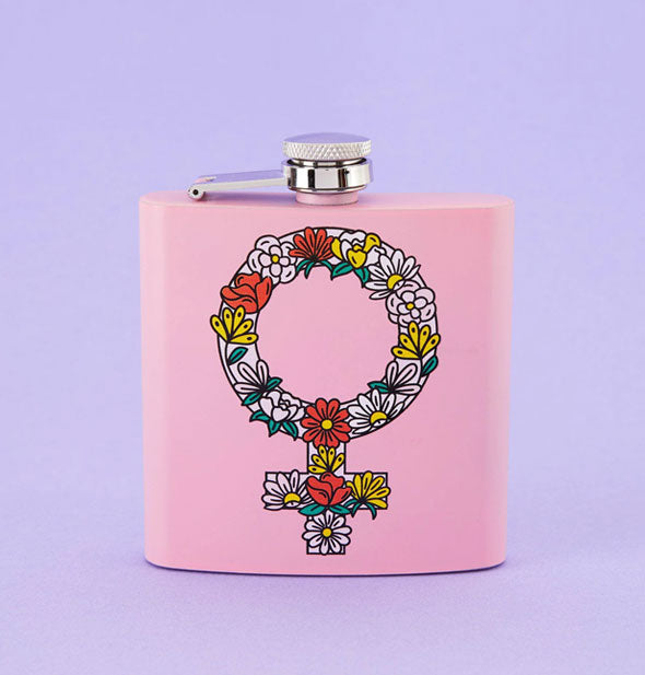 Square pink flask with illustration of the female sex symbol covered in flowers