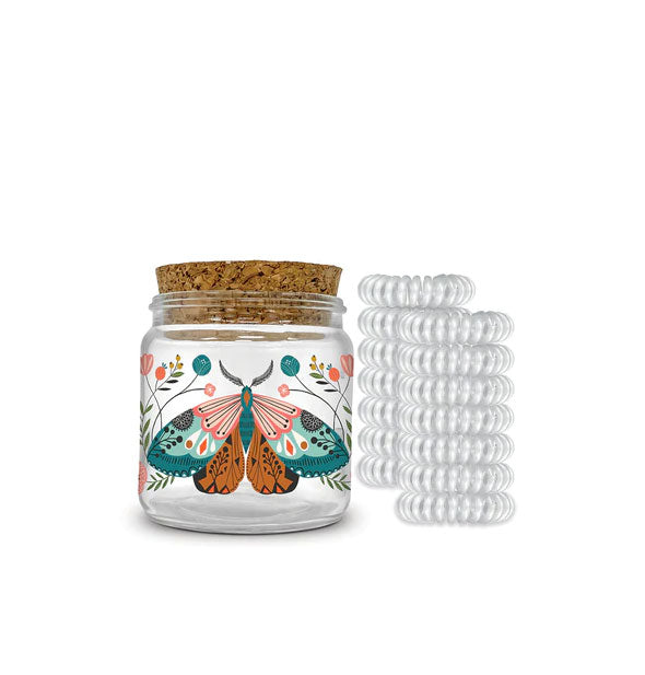 Cork-lidded jar with floral moth illustration is paired with 12 clear spiral hair ties