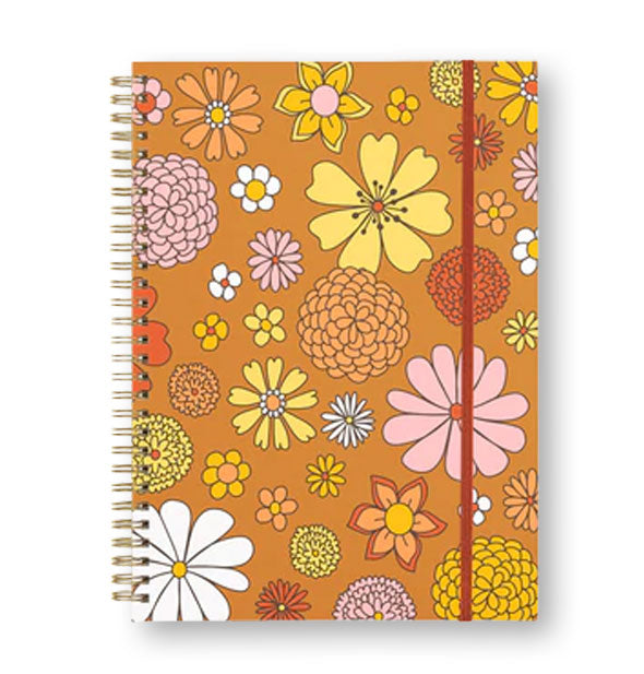 Spiral-bound orange notebook cover with flower illustrations and a red elastic band to hold it closed
