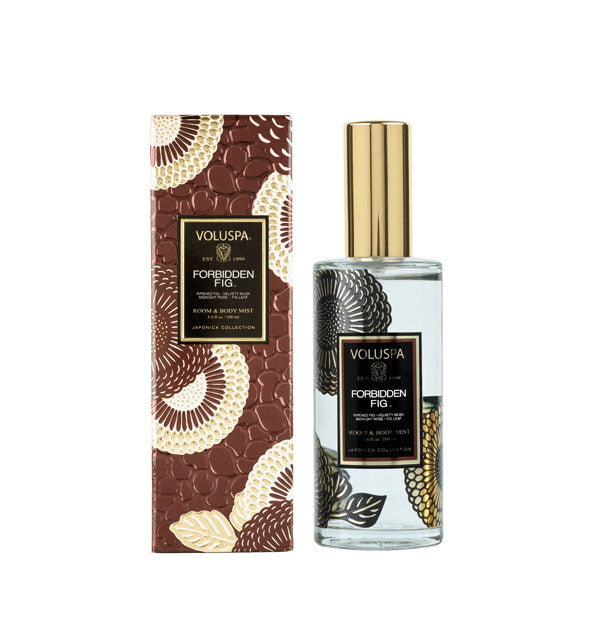 Bottle of Voluspa Forbidden Fig scent spray next to ornate textured metallic box packaging