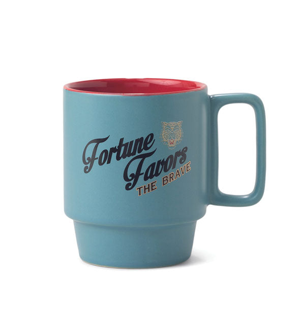 Blue mug with red interior, squared handle, and stackable design says, "Fortune Favors the Brave" in gold-accented lettering with a roaring tiger grphic