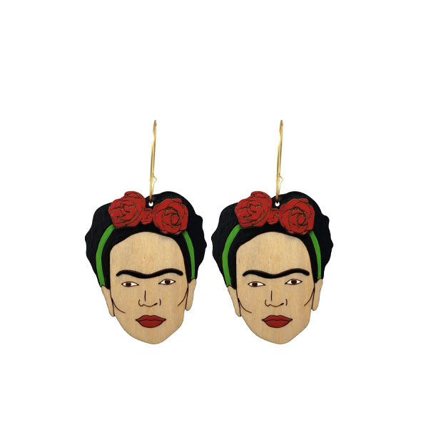 Pair of painted wood Frida Kahlo head earrings on gold hoops