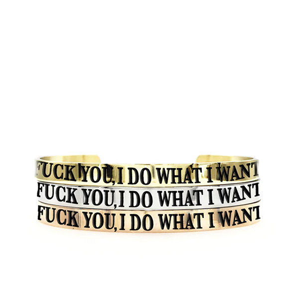 Stack of 3 wide bangles in gold, silver, and rose gold with the imprint, "Fuck You, I Do What I Want."