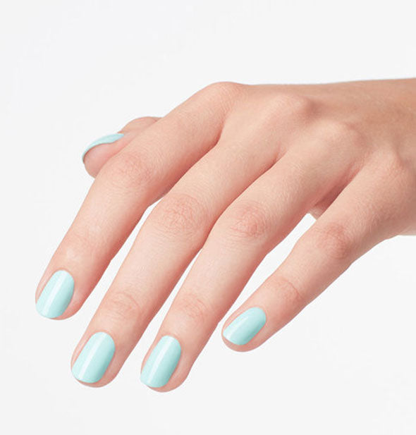 Model's hand wears a robin's egg blue shade of nail polish