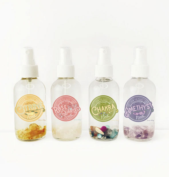 Four bottles of Sow the Magic gemstone-infused scent tonic for room and body: Citrine, Rose Quartz, Chakra, and Amethyst