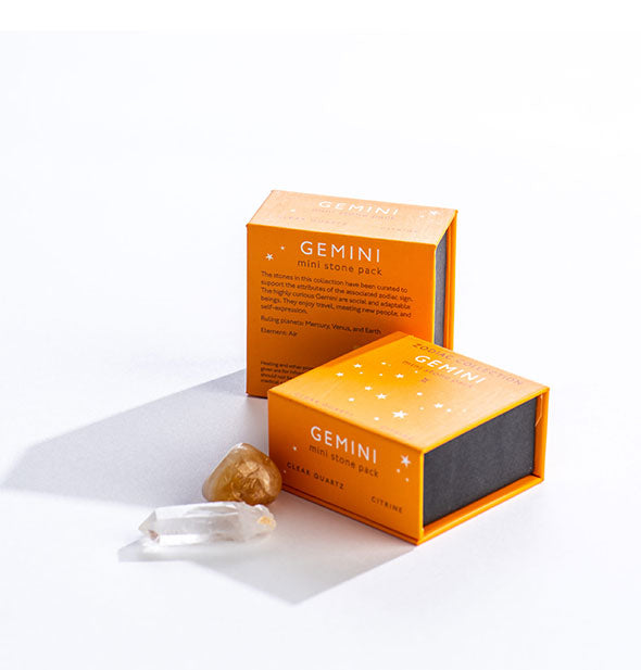 Two orange Gemini Mini Stone Packs with crystals displayed in front.