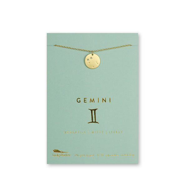 Gold Gemini necklace on card with metallic gold print and symbol