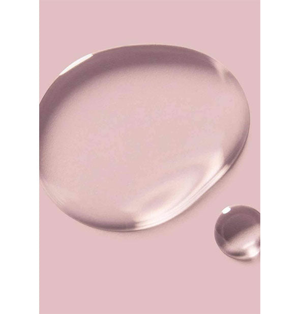 Sample droplets of Verb Ghost Oil on pink surface