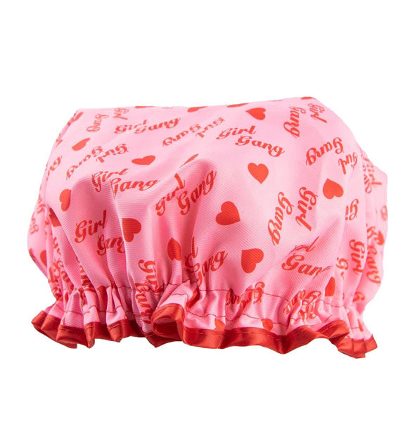Ruffled shower cap with red and pink heart print that says, "Girl Gang"