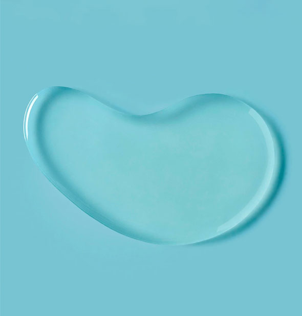 Sample droplet of Verb Glossy Shampoo on blue background