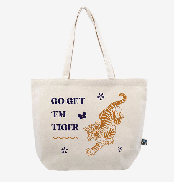 White canvas tote bag says, "Go get 'em tiger" alongside a golden roaring tiger illustration and several design accents