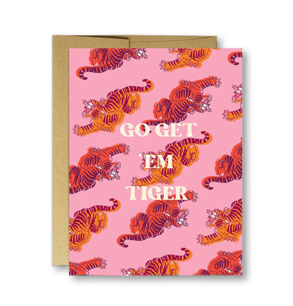 Pink greeting card on top of kraft envelope features all-over red and orange tiger illustrations and the message, "Go get 'em tiger" in white lettering