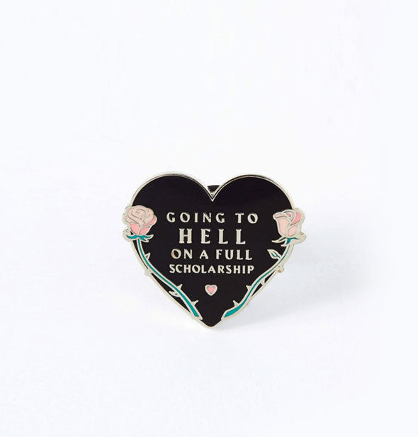 Black enamel heart-shaped pin with thorny rose border and mini heart accent says, "Going to Hell on a Full Scholarship"
