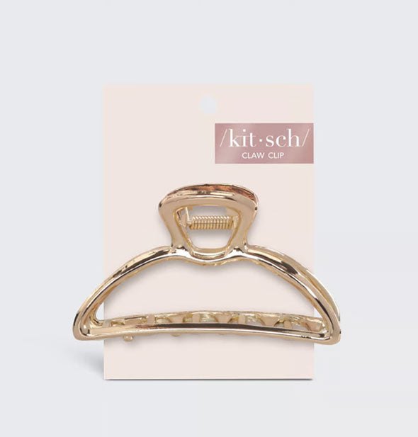 Rounded shiny gold hair claw clip on light pink Kitsch product card