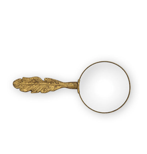 Gold magnifying glass with feather-shaped handle