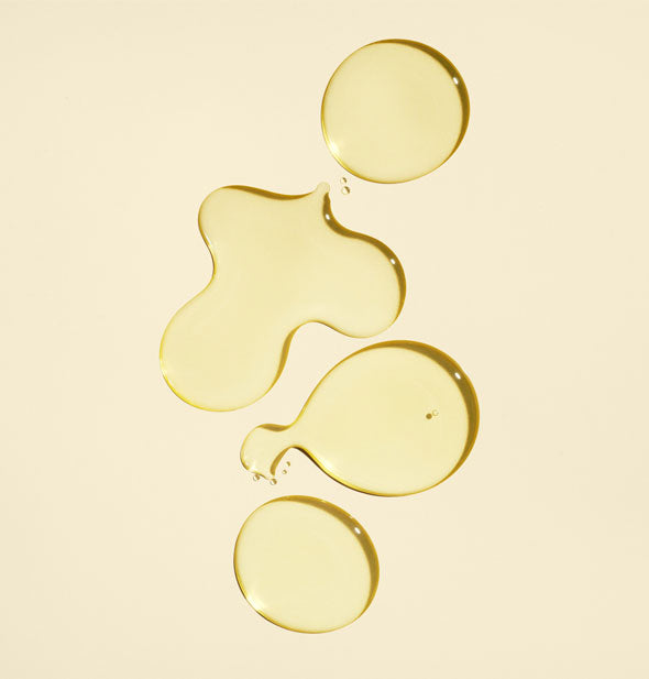 Sample droplets of Oribe Gold Lust All Over Oil