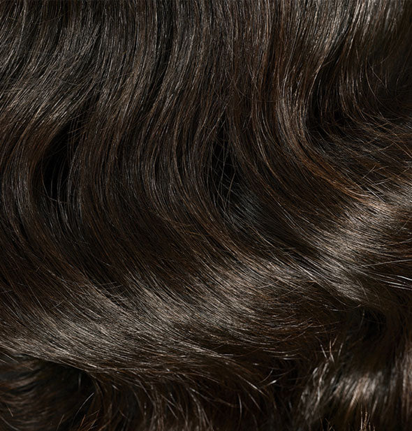 Closeup of wavy hair styled with Oribe Gold Lust Nourishing Hair Oil